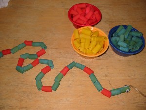 We added googly eyes to one end and made "snakes". This particular snake was patterned blue-blue-red.